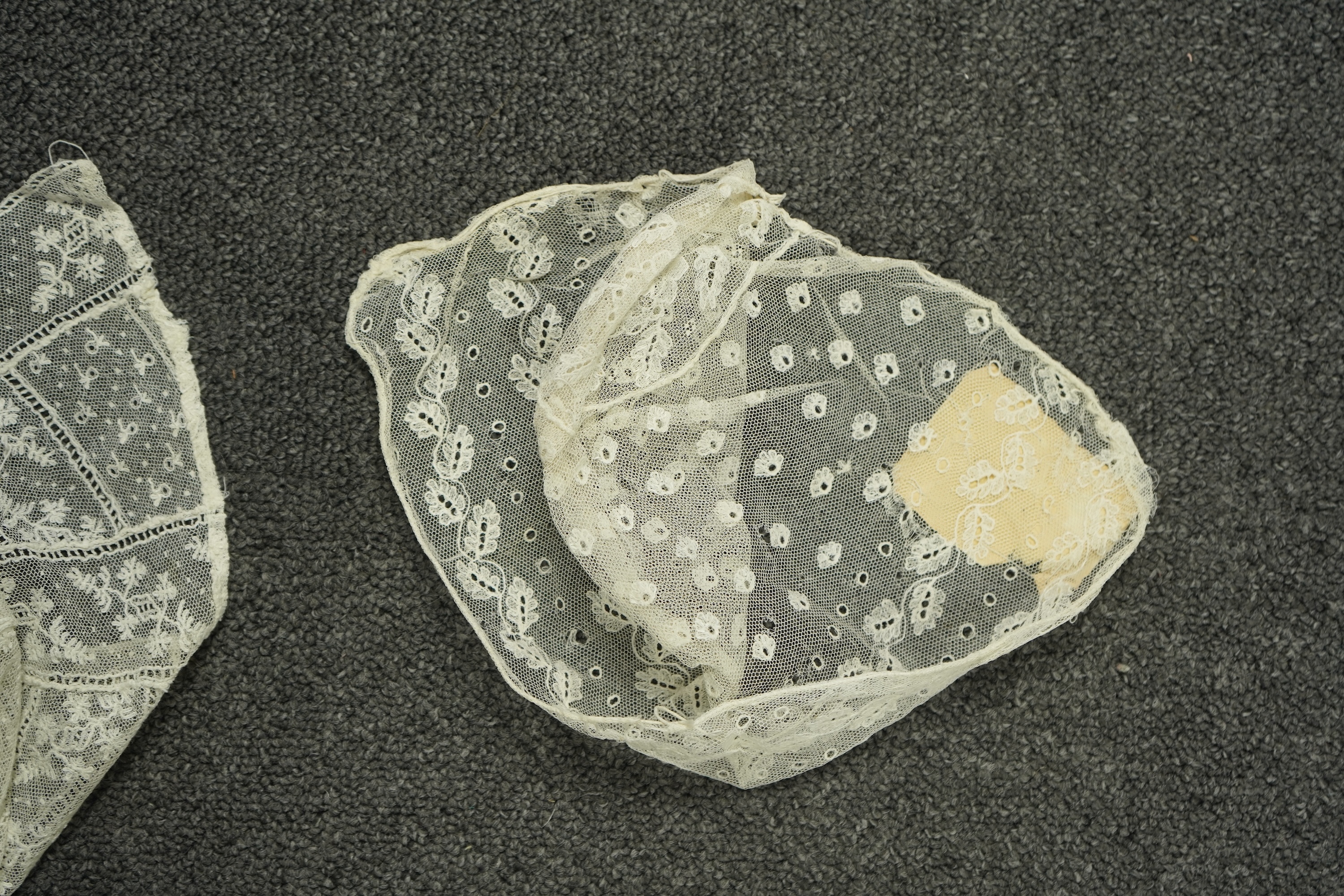Various lengths of 18th and 19th century lace trimming and two needle run bonnets. Including a collar made from two rows of 18th century Valenciennes lace, a length Valenciennes lace, a shorter length of Pointe de Anglet